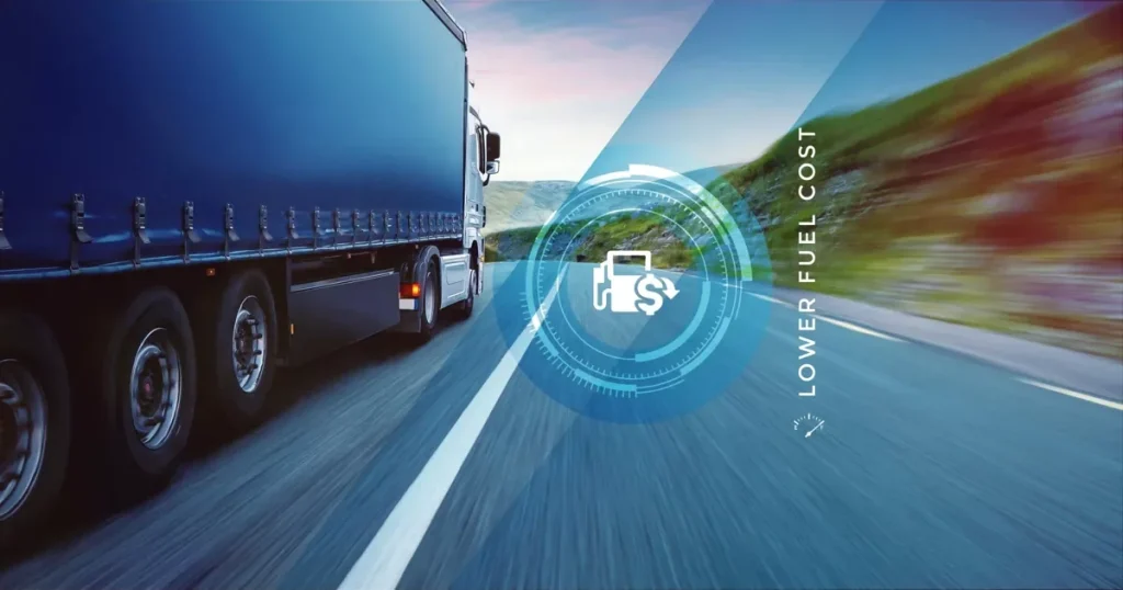 Articulated truck on an open road with a lower fuel cost gauge