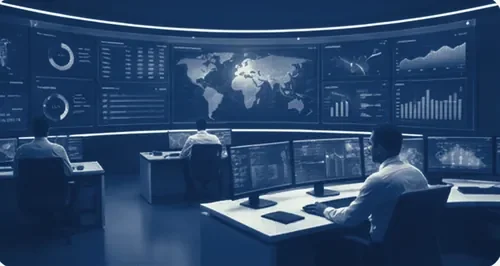 Operators at a monitoring centre in front of a wall of live map and data screens