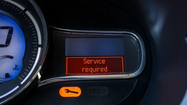 Service required warning lit on a vehicle instrument cluster