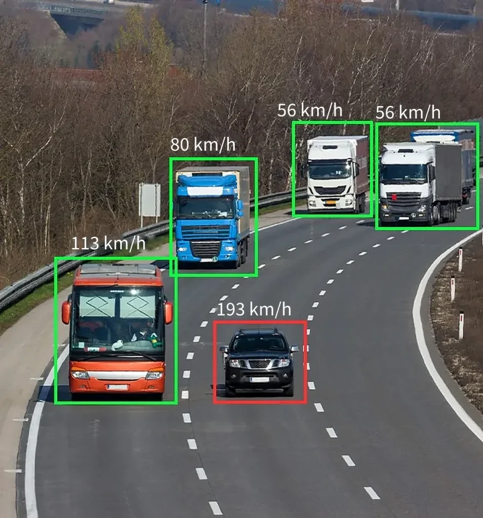 Vehicles on a highway boxed by AI detection with their speeds flagged in km/h